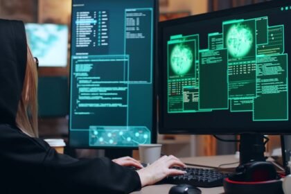 Forensic analyst reviewing flagged AI-generated faces and audio waveforms across multiple monitors in a dim operations room